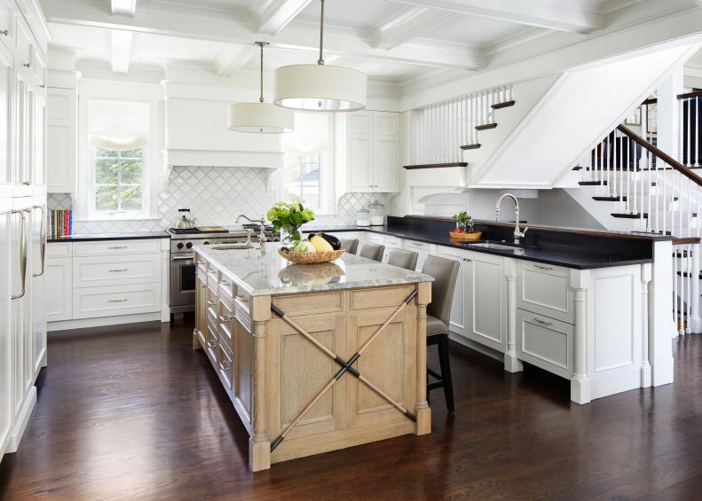 This renovated kitchen features a black-and-white design.