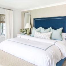 Neutral Transitional Bedroom With Blue Bed