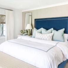 Neutral Transitional Bedroom With Blue Bed