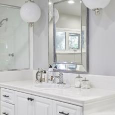 White Bathroom With Globe Pendants