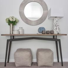 Gray Console Table and Silver Vase