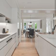 White Open Plan Kitchen With Gray Faucet