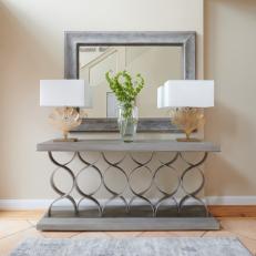 Silver Console Table and Beige Lamps