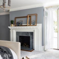 Gray Bedroom and Marble Fireplace