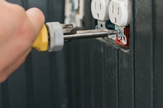 Place a couple of plastic outlet extenders on the bolt behind the outlet and reattach