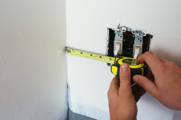 Measure the distances to determine where each outlet will sit within each panel.