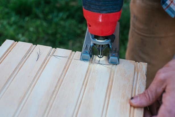 Use a jigsaw to make cut for outlets in beadboard wainscoting