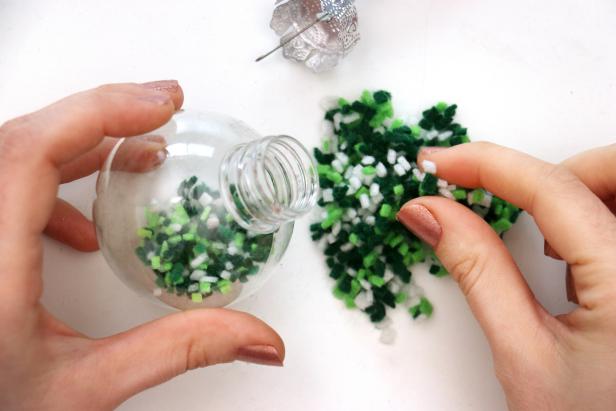 Fill a clear ornament with your felt confetti. Add the topper, gluing it in place to avoid a mess if you have kids or pets.