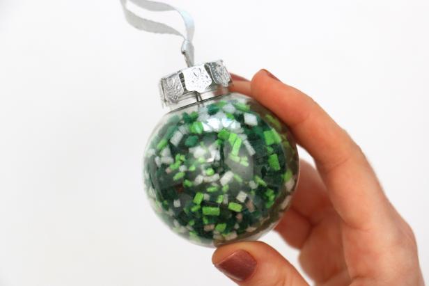 Fill a clear ornament with your felt confetti. Add the topper, gluing it in place to avoid a mess if you have kids or pets.