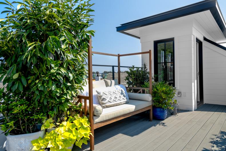 Tin has created a private garden sanctuary on the roof of her home featuring two daybeds and an array of trees and plants including lemon trees, tea olive, potato vine, creeping Jenny and gardenias, many of which lend fragrance to her rooftop garden.
