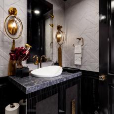 Black and White Powder Room With Gold Sconces