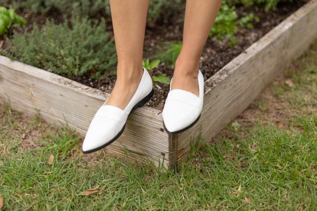 Pointy white shoes make a stylish statement.