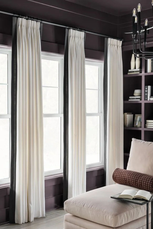 Windows Fill Dark-Purple Sitting Room With Natural Light