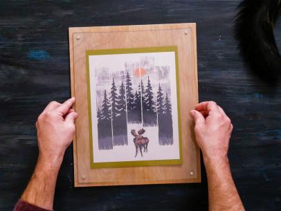 Hands Holding Finished Magnetic Acrylic Frame With Photo of Trees
