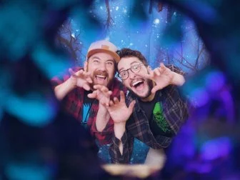 Two Men Make Silly Faces Inside DIY Halloween Photo Booth