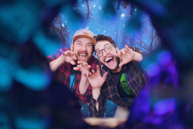 Two Men Make Silly Faces Inside DIY Halloween Photo Booth