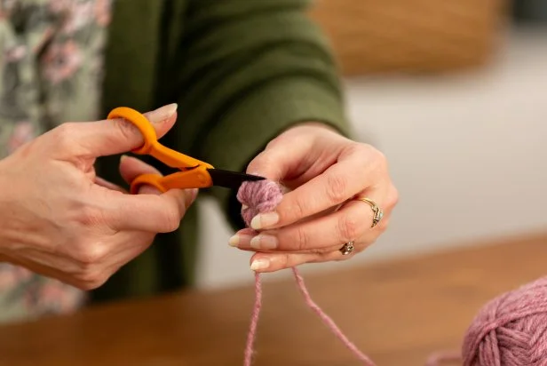 Gently slip the bundle off of the fork. Using scissors, cut the loops at both ends.