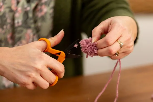 Gently slip the yard bundle off the fork. Using scissors, cut the loops at both ends and trim the classic, round shape.