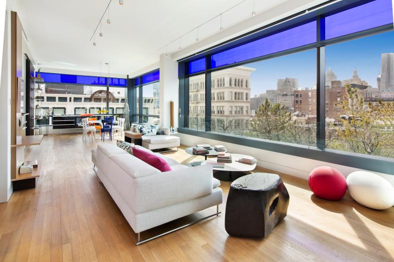 Designed by renowned French architect Jean Nouvel who is the winner of multiple awards including the Pritzer Prize, 40 Mercer is Nouvel's first New York project. Located in the heart of Manhattan's Soho neighborhood, this loft-style 2,200 square foot apartment features 11 foot ceilings and the incredible view only a corner lot could deliver. An automated glass curtain wall opens to allow the outdoors in.