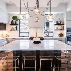 White Modern Chef Kitchen With Lucite Barstools