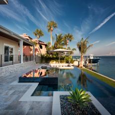 Small Waterfront Backyard With Infinity Pool