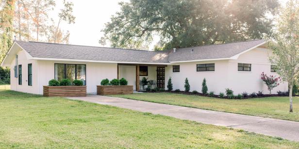 As seen on Home Town, the Turner residence has been fully renovated by Ben and Erin Napier. After renovations, their Laurel, MS home now features a freshly painted exterior, wooden beam accents, and the conversion of a carport to living room for added space. (After)