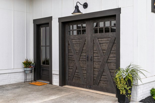 Stained composite overlays are adhered to a steel door with a woodgrain paint finish.