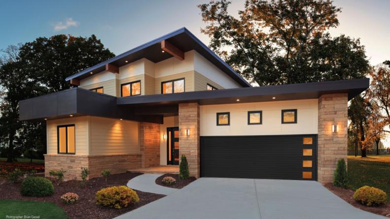 These garage doors by Clopay come in a number of styles and colors. Windows can be added in different configurations to create a unique style and bring natural light into the garage.