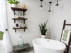 See how we added inexpensive and stylish storage in a bathroom by upcycling old wood into new shelves.