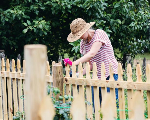 Add classic charm and curb appeal to your yard with a DIY fence that's easier to install than you might think.