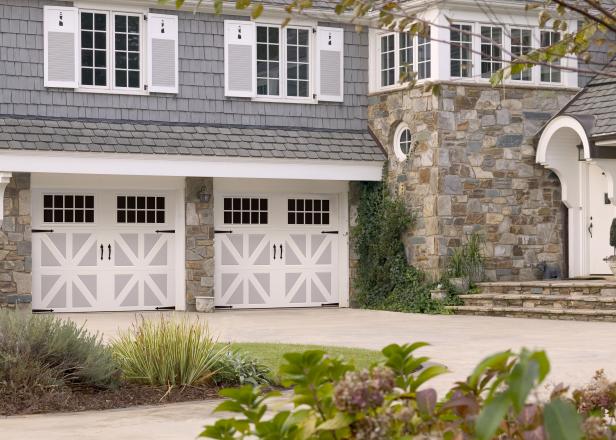 White and gray garage doors and mixed-texture exterior