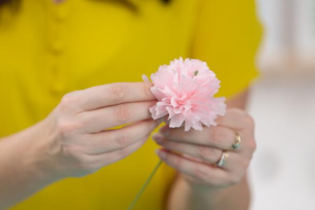 Wrap the crepe paper around the floral stem, creating tiny pleats as you turn the base.