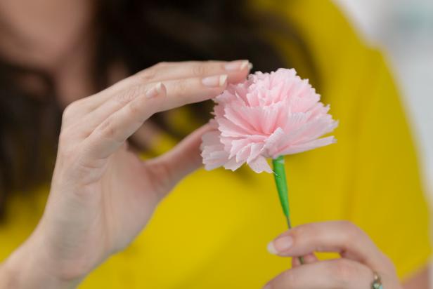 Create gorgeous paper flowers with this easy how-to from Marianne Canada. All you need is a roll of party steamers, scissors, glue, floral tape and a floral stem.