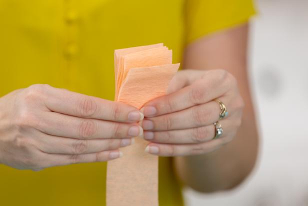 Fold the crepe paper accordion style in three inch sections.