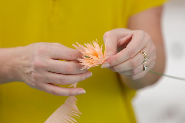 Wrap the crepe paper around the floral stem, making tiny pleats as you turn.
