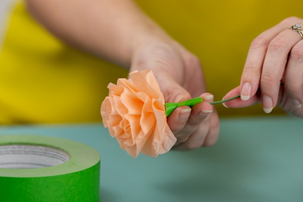 Using floral tape, wrap the base of the finished flower to secure it to the floral stem.
