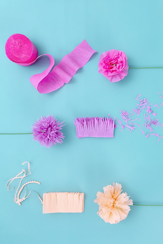 Overhead View of Party Streamers and Paper Flowers on Table