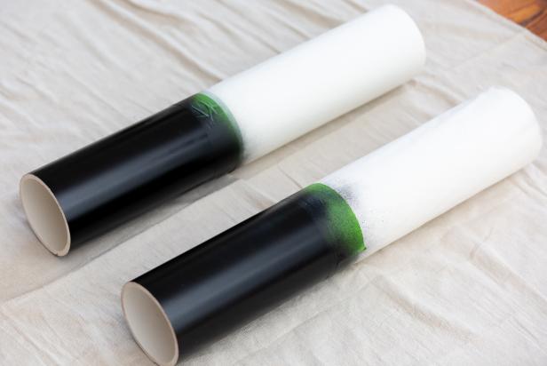 These PVC pipes have been masked with masking tape and painted to resemble giant nutcracker legs.