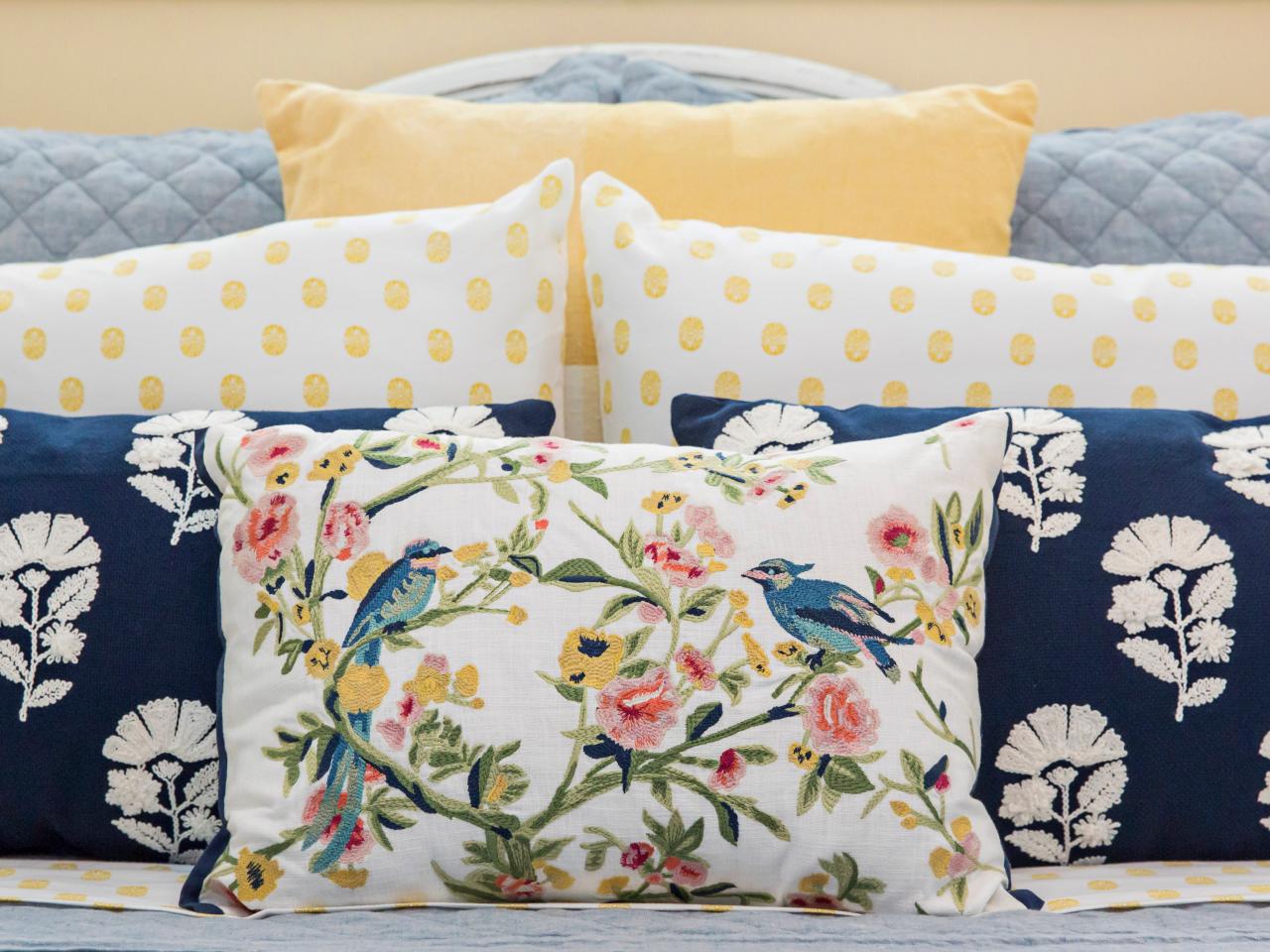 https://hgtvhome.sndimg.com/content/dam/images/hgtv/fullset/2020/3/0/Original_Camille-Smith_Bedroom-yellow-dot-sheets-chambray-quilt-bird-floral-pillows-horiz.jpg.rend.hgtvcom.1280.960.suffix/1583167659814.jpeg