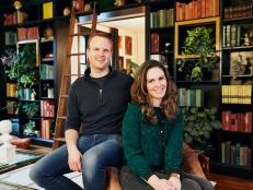 Kate Pearce and her husband, BIll, sit in their home library