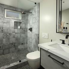 Gray Bathroom With Pebbled Floor