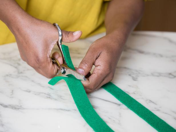 Craft scissors are perfect for cutting grass out of green felt. The ridged blades make the cut surface look like grass with minimal effort.