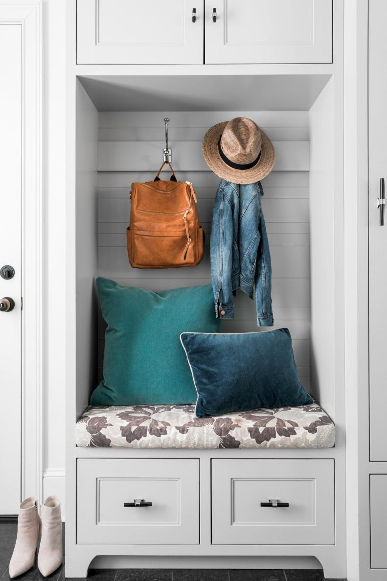 When budgeting for a mud room design, consider investing in as much floor to ceiling integrated storage as possible. This will keep the space looking more tailored and tidy since most of the clutter will be concealed behind door fronts and drawer fronts.