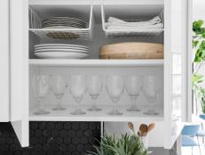 Stacking plates too high inside cabinets can result in a tumbling disaster. Put the dead space at the top of each interior cabinet to good use with plate shelving. These simply slide on to the shelf above each interior unit, turning empty space into valuable storage.