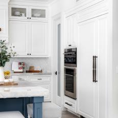 White Transitional Kitchen With Spool Barstools