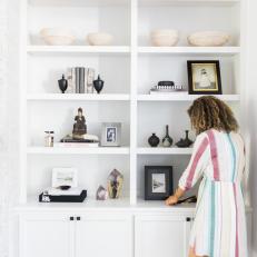 White Built-In Bookshelves With Bowls