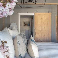 Transitional Bedroom With Paneled Barn Door