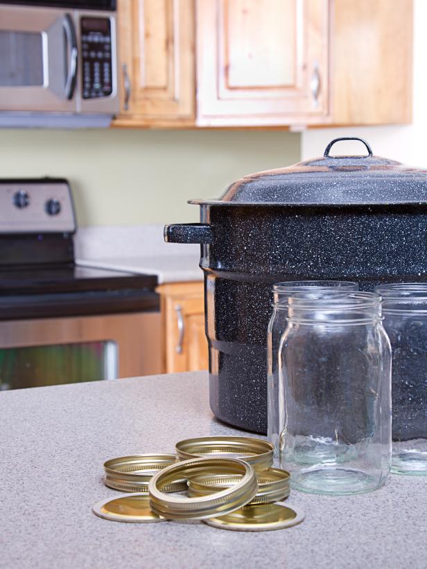 A pot and canning jars used in sterilizing canning jars.