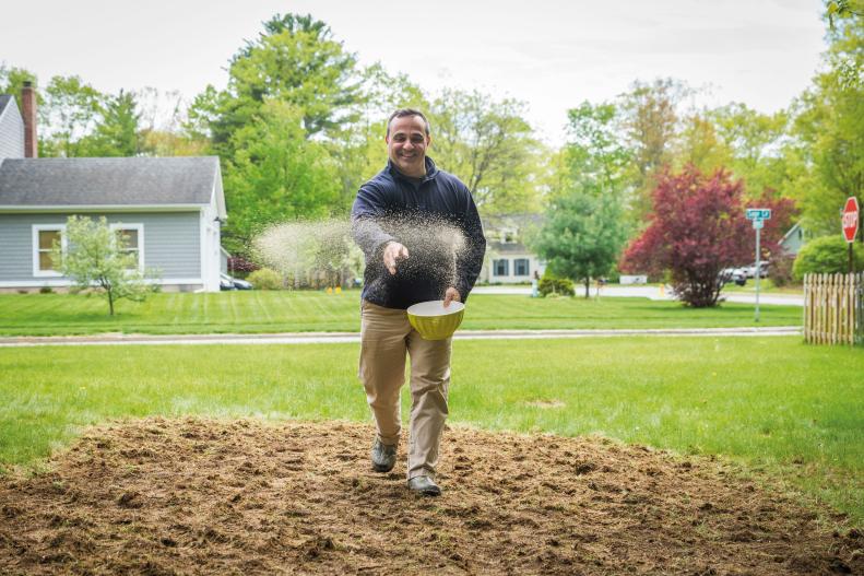 Garden author Mike Lizotte sows seeds for a mini meadow by hand.