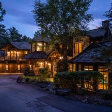 Rustic Countryside Mansion's Thoughtful Exterior and Interior Lighting Glow in the Night 